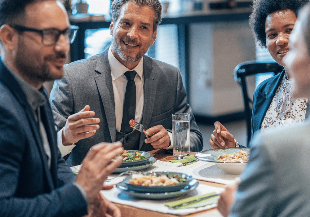 Professionals networking over dinner.