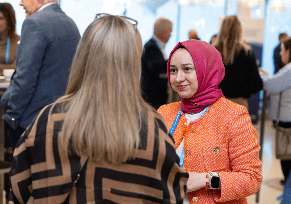 HR professionals discussing ideas at an event.