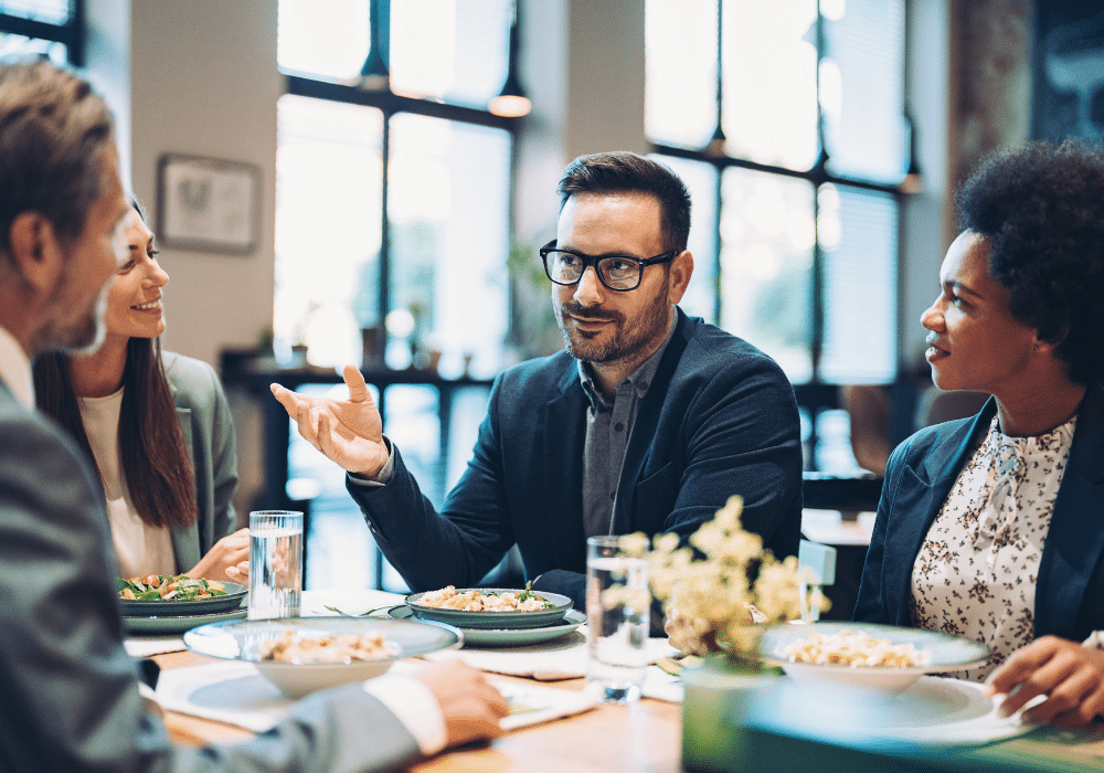 HR professionals discussing business over a meal.
