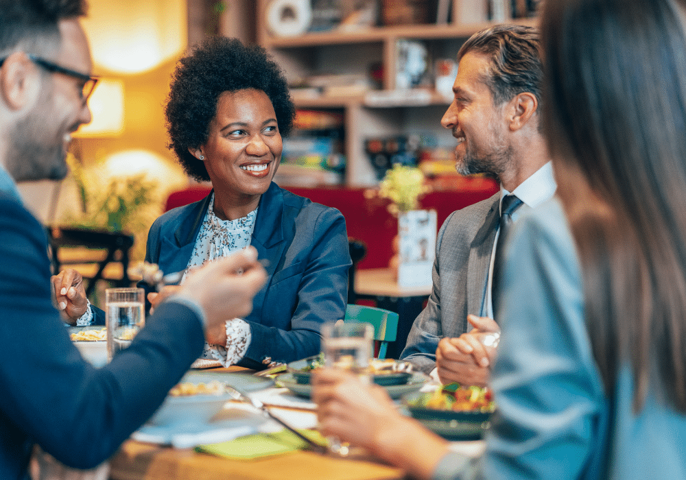Professionals discussing business over a meal.
